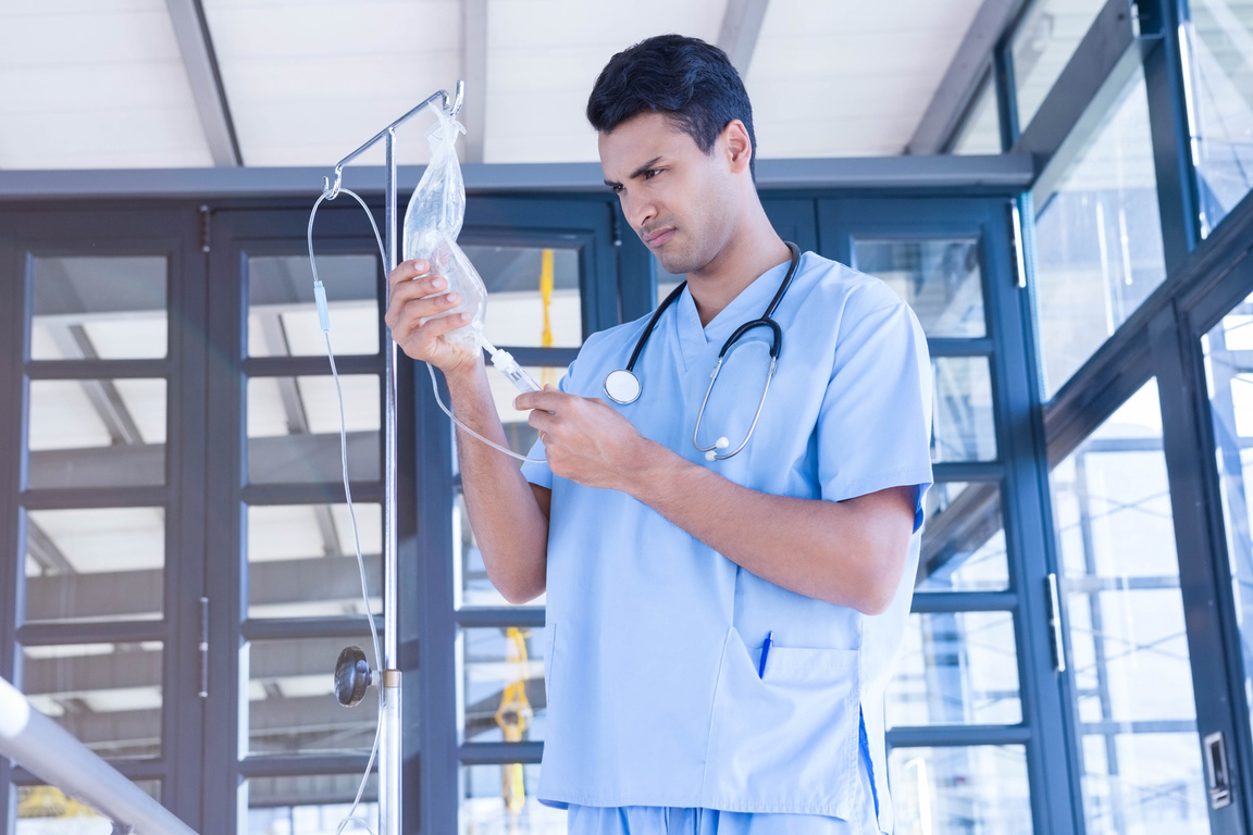 Doctor examining intravenous drip